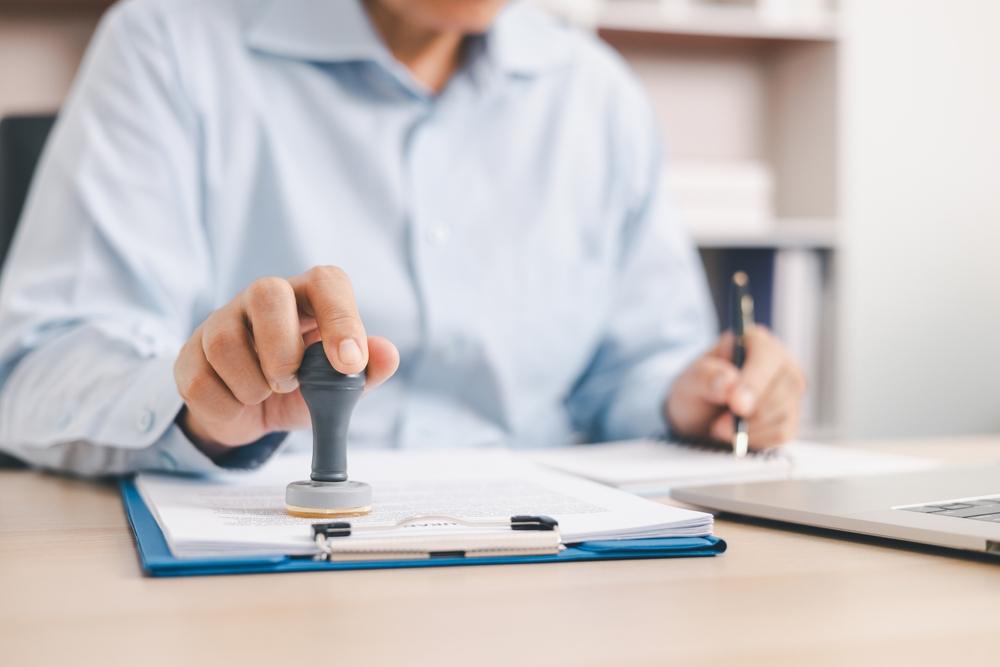 A person placing an official stamp on a certificate of trust. What is a Certification of Trust?